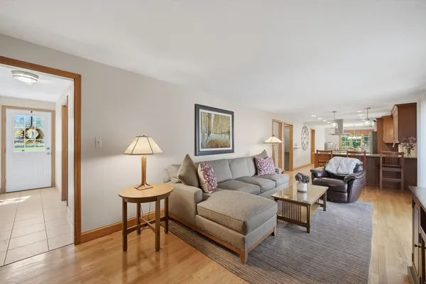 a living room with furniture or wooden floor and a lamp