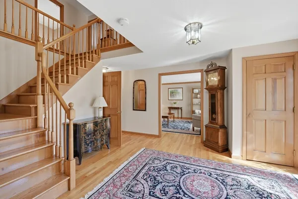 a view of an entryway with wooden floor