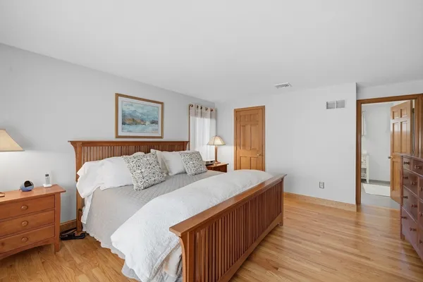 a bedroom with a bed and a closet