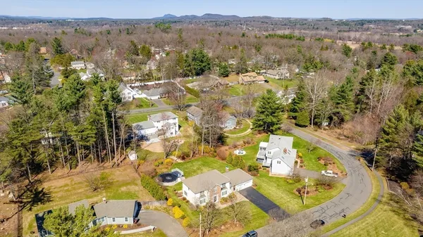 an aerial view of residential house with outdoor space