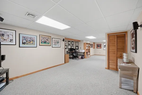 a view of a livingroom with furniture and a ceiling fan