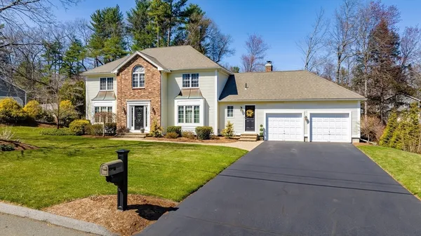 a front view of a house with swimming pool having outdoor seating