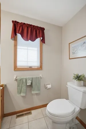 a bathroom with a toilet and a sink