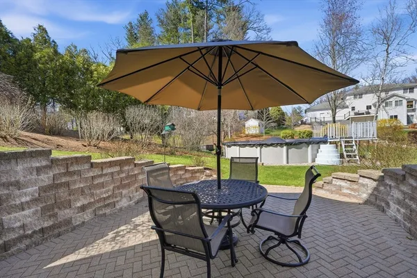 a view of an outdoor sitting area with swimming pool and furniture