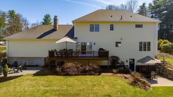 a view of a house with swimming pool in front of it