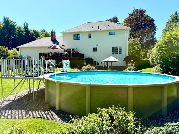 a view of swimming pool with a patio