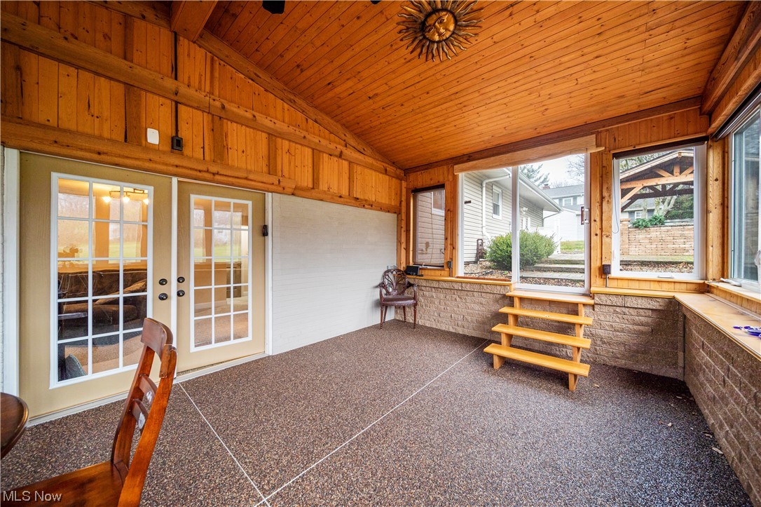 9944 Hoose Road Mentor, OH 44060 - Photo 25 of 35 Sunroom / solarium featuring wood ceiling, vaulted ceiling, and french doors