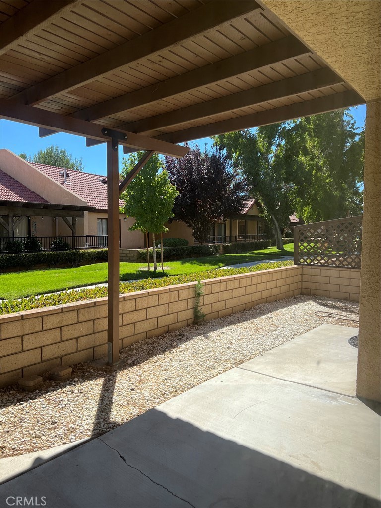 11687 Maple Street Apple Valley, CA 92308 - Photo 3 of 15 a view of a porch and yard