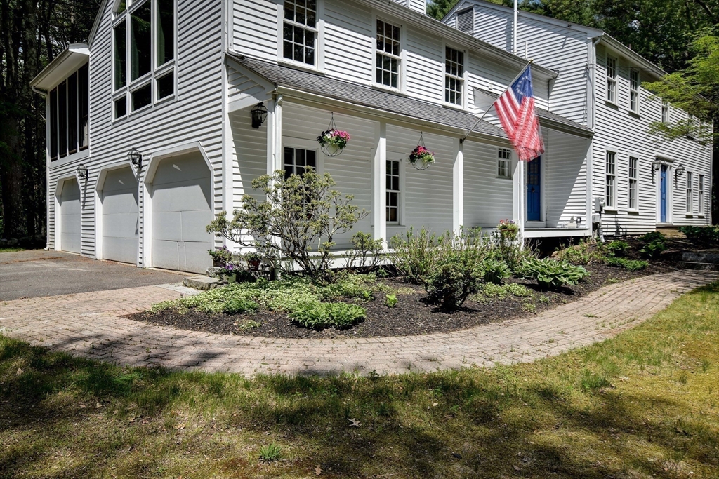 114 Hunters Ridge Road Concord, MA 01742 - Photo 3 of 38 a front view of a house with a yard