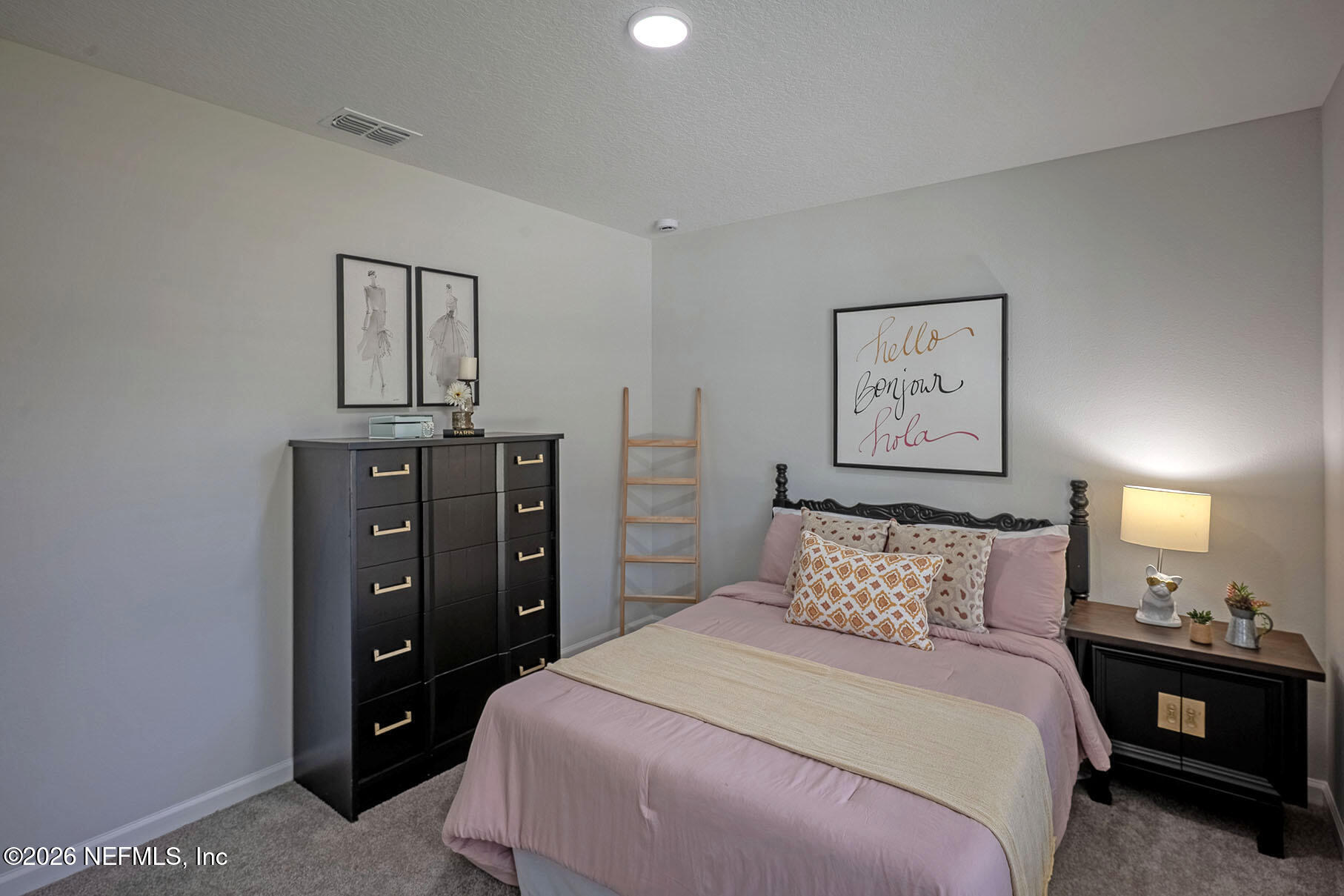 1295 Jewelstone Lane Jacksonville, FL 32221 - Photo 13 of 33 a bedroom with a bed and lamp