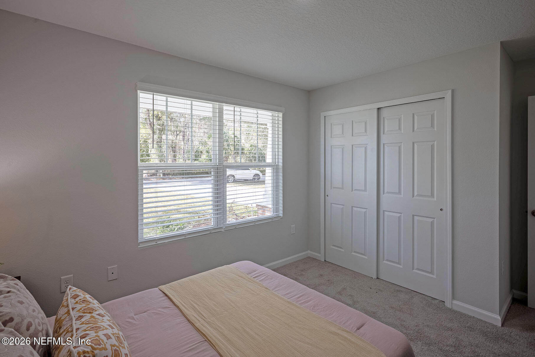 1295 Jewelstone Lane Jacksonville, FL 32221 - Photo 14 of 33 a bedroom with a bed and a window