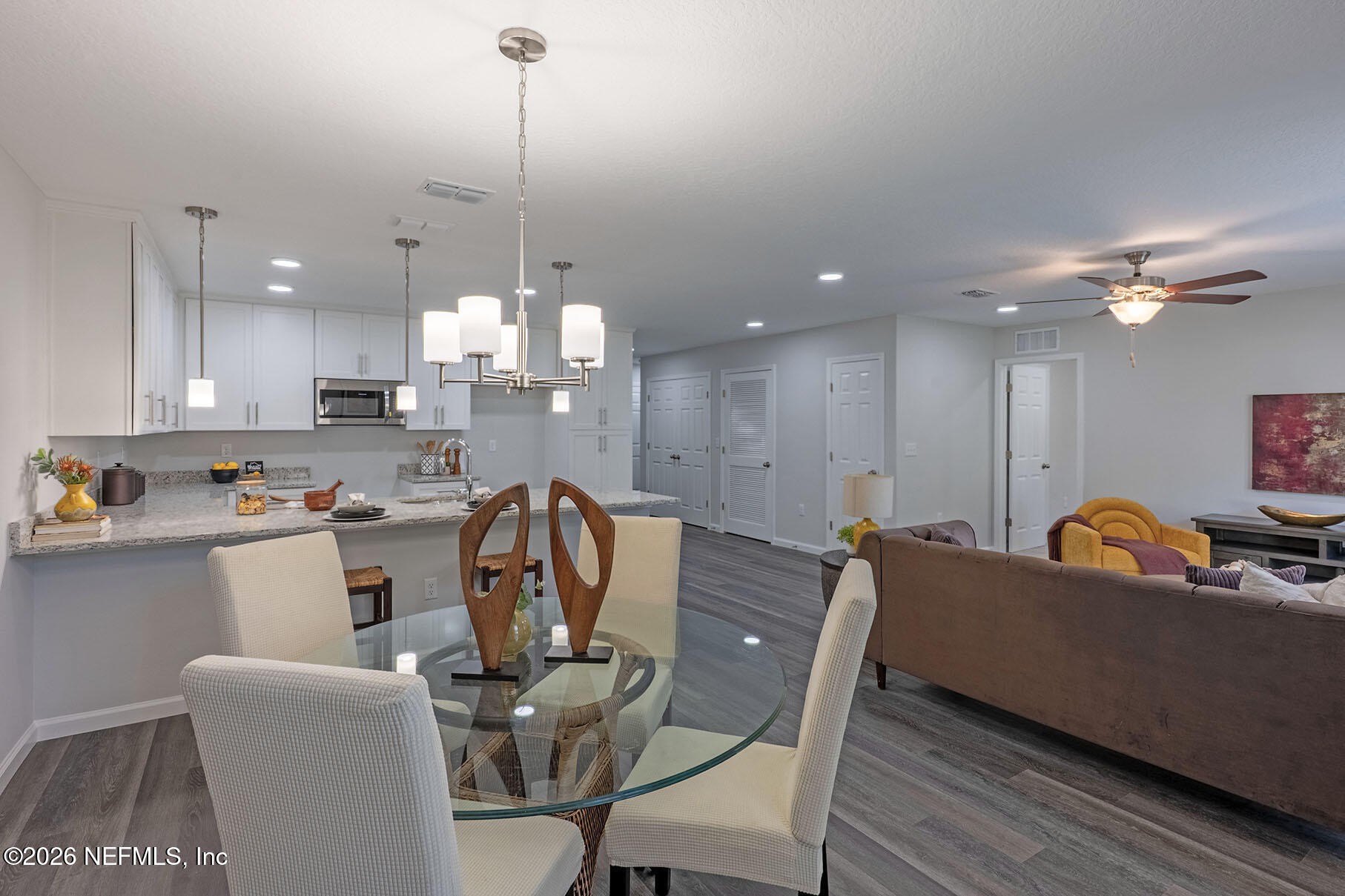 1295 Jewelstone Lane Jacksonville, FL 32221 - Photo 24 of 33 a view of a dining room with furniture and chandelier