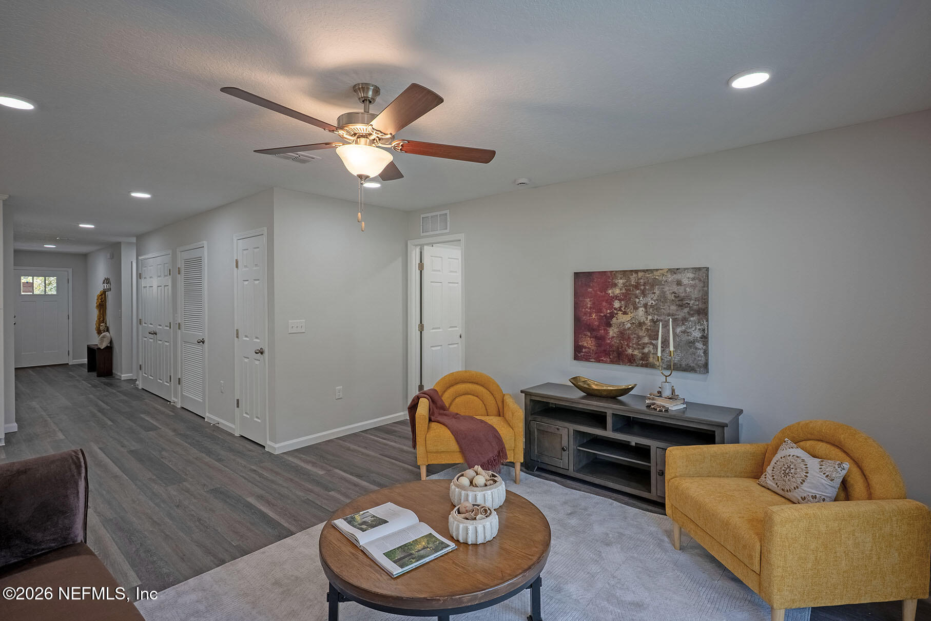1295 Jewelstone Lane Jacksonville, FL 32221 - Photo 28 of 33 a living room with furniture and a chandelier