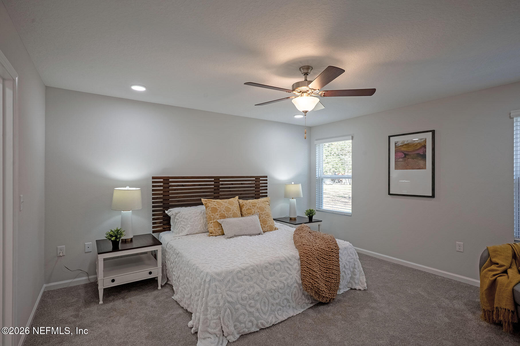 1295 Jewelstone Lane Jacksonville, FL 32221 - Photo 29 of 33 a bedroom with a bed and a ceiling fan