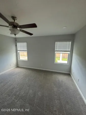 a bedroom with a bed and lamp