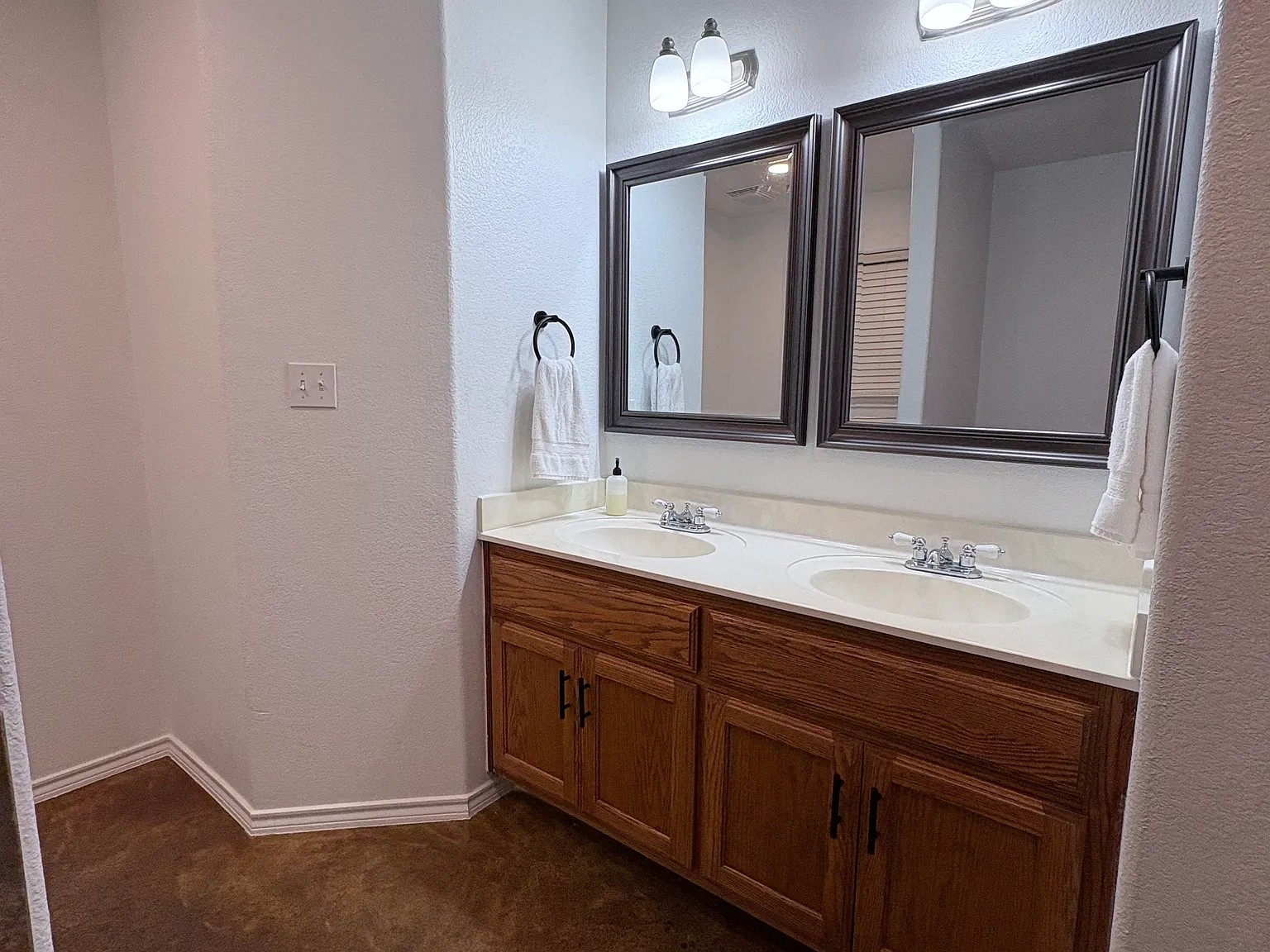 430 Summit Ridge Drive North Point Venture, TX 78645 - Photo 12 of 26 Double vanity with ample storage beneath offers functional elegance.