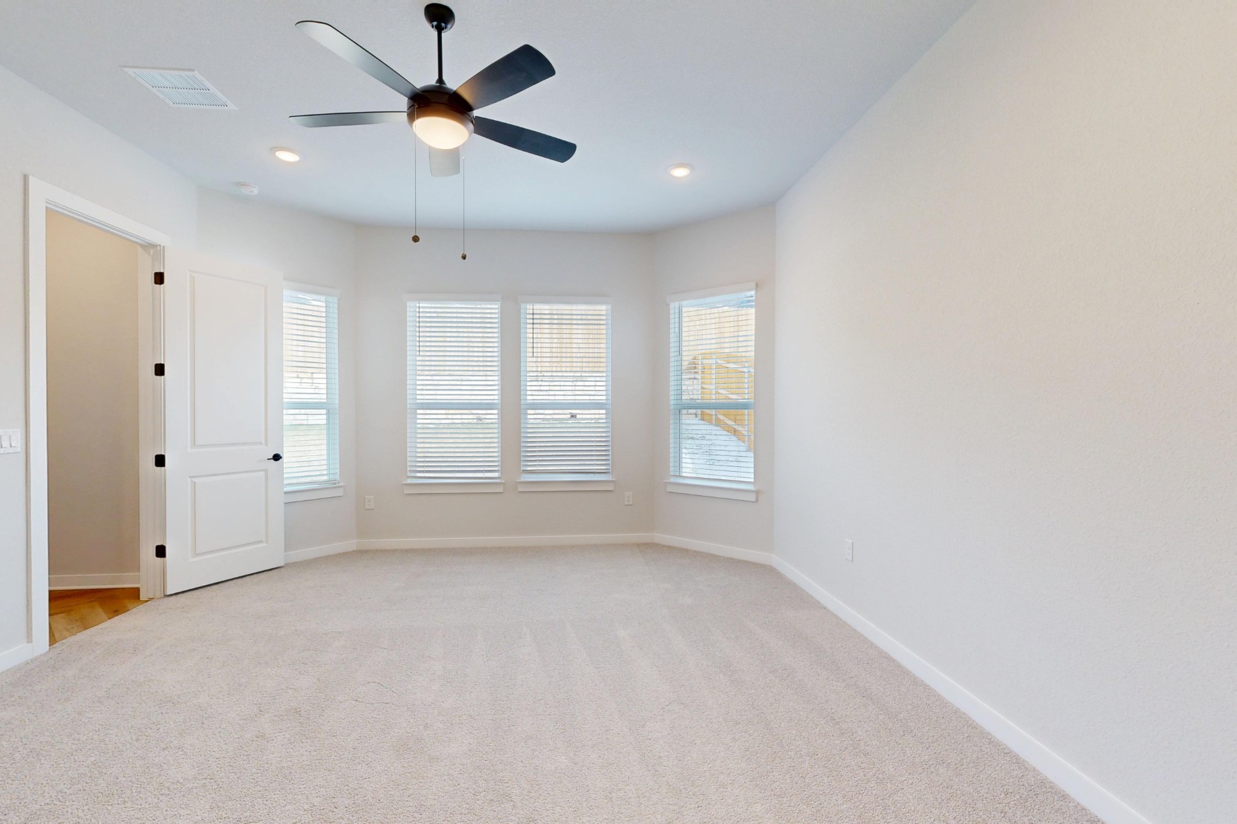 812 Boise Drive Leander, TX 78641 - Photo 13 of 35 wooden floor in an empty room with a window