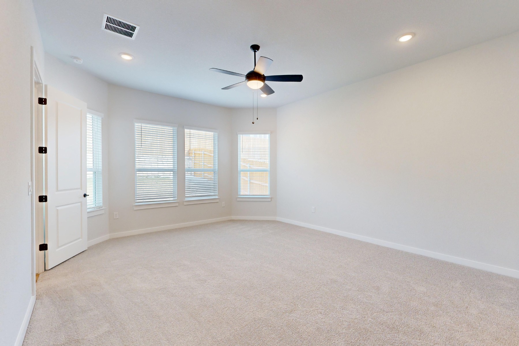 812 Boise Drive Leander, TX 78641 - Photo 14 of 35 an empty room with windows and fan