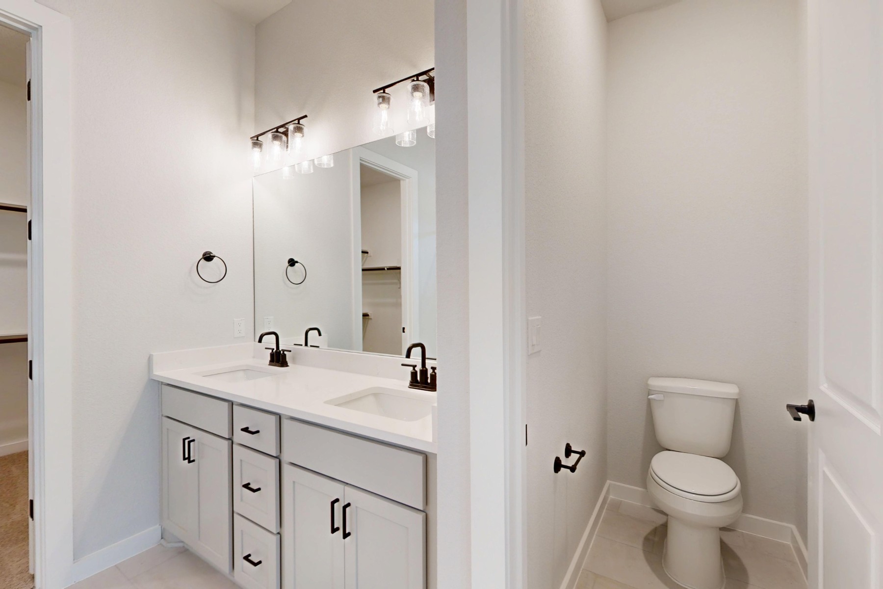 812 Boise Drive Leander, TX 78641 - Photo 18 of 35 a bathroom with a sink a toilet and a mirror