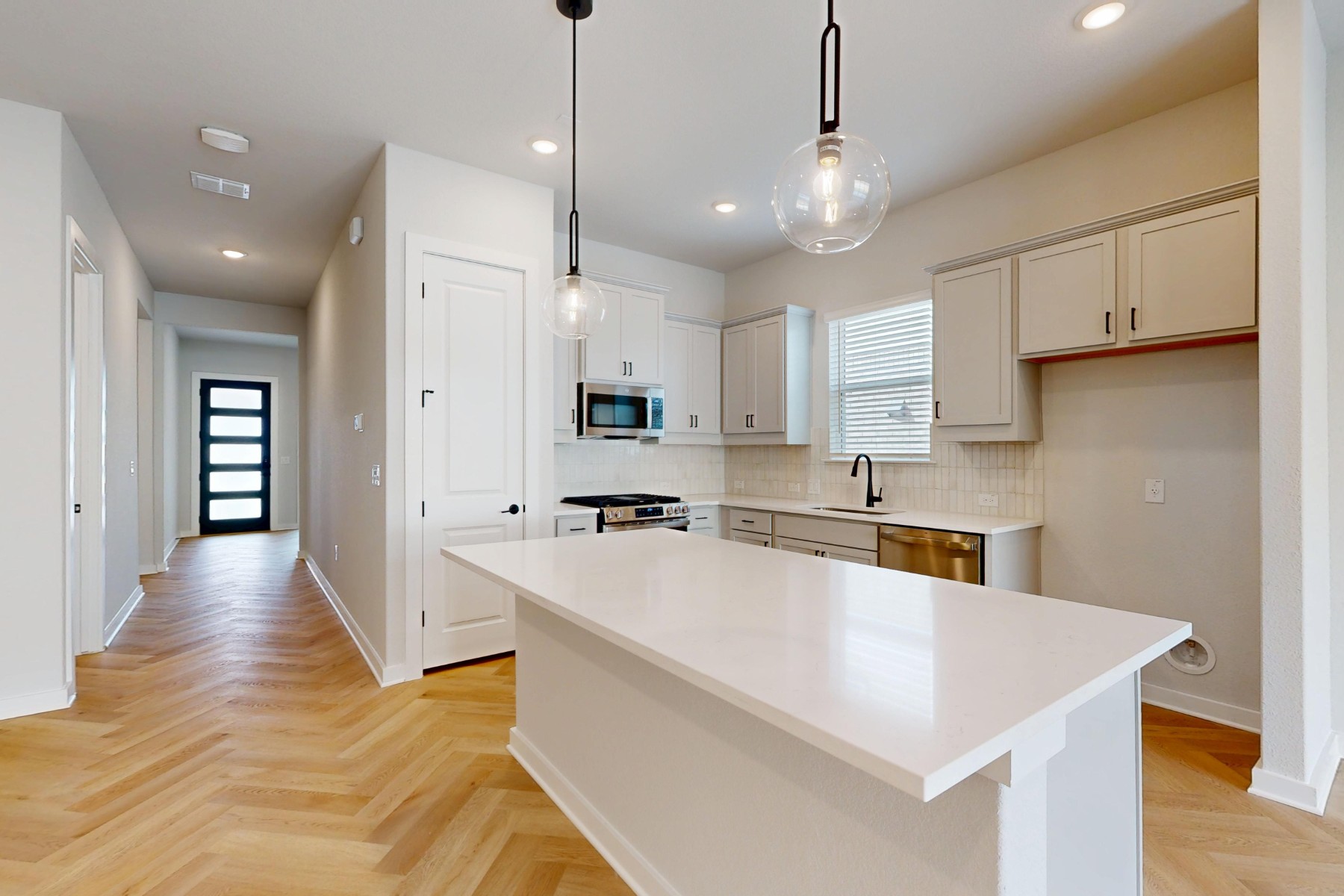 812 Boise Drive Leander, TX 78641 - Photo 2 of 35 a large white kitchen with lots of counter space cabinets and appliances