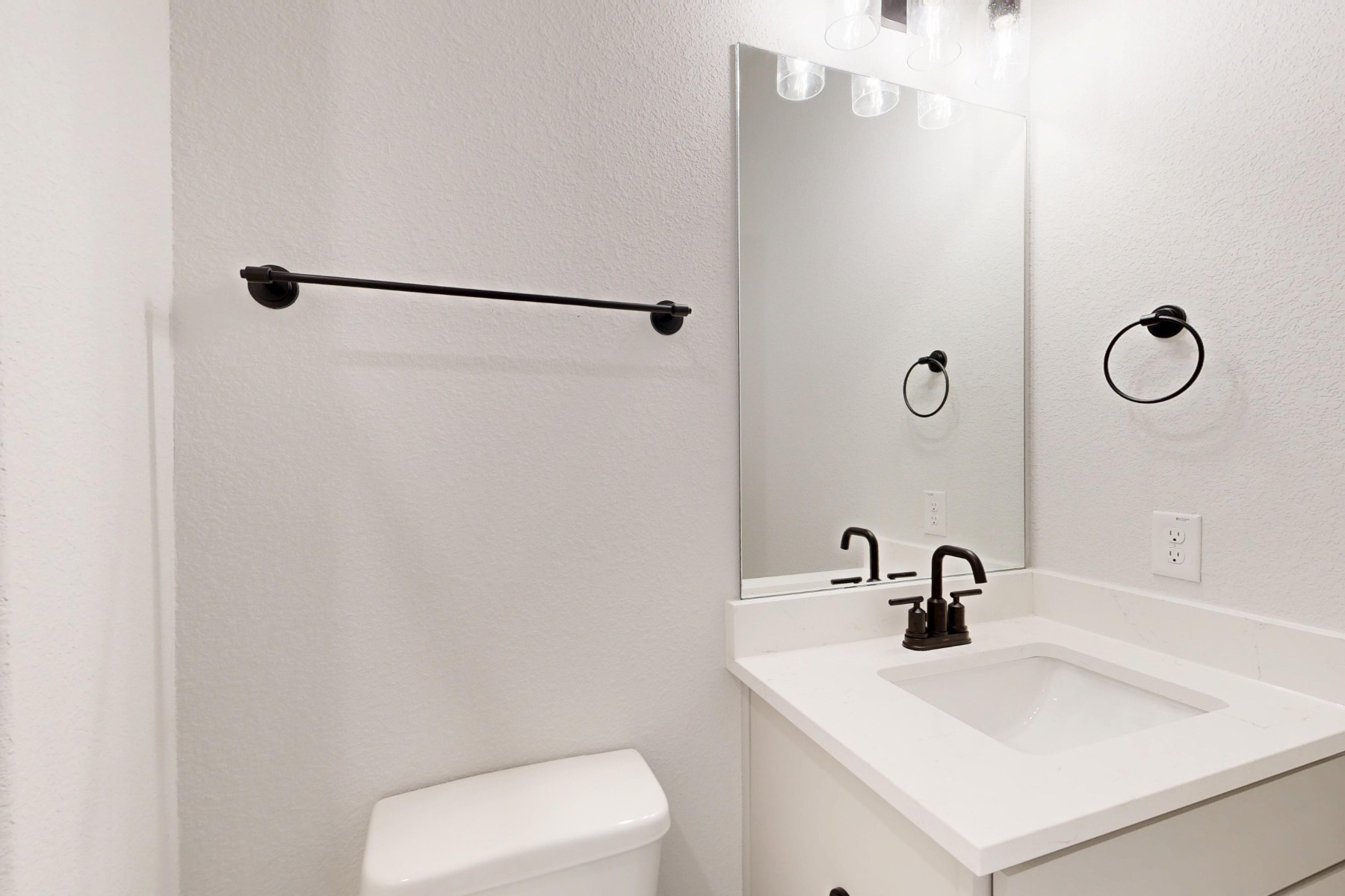 812 Boise Drive Leander, TX 78641 - Photo 24 of 35 a bathroom with a sink toilet and mirror