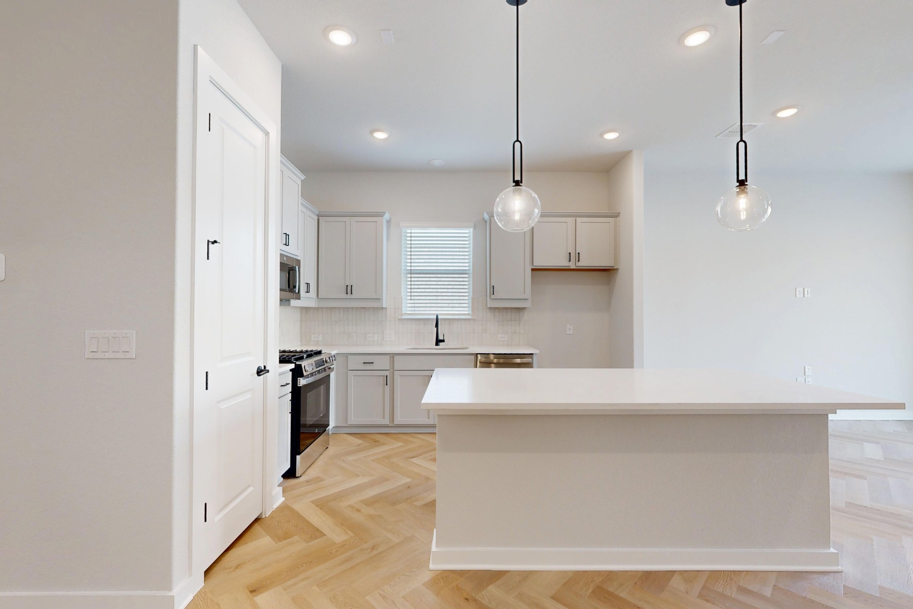 812 Boise Drive Leander, TX 78641 - Photo 3 of 35 a large kitchen with stainless steel appliances kitchen island granite countertop a sink a stove and a refrigerator