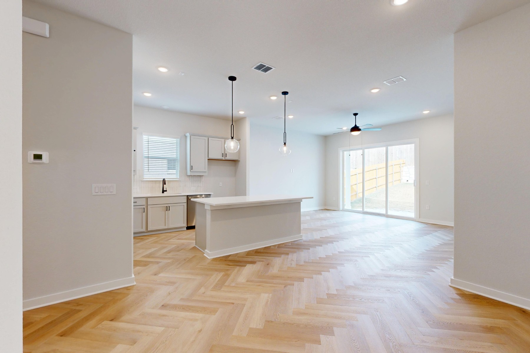 812 Boise Drive Leander, TX 78641 - Photo 4 of 35 a large white kitchen with a large window