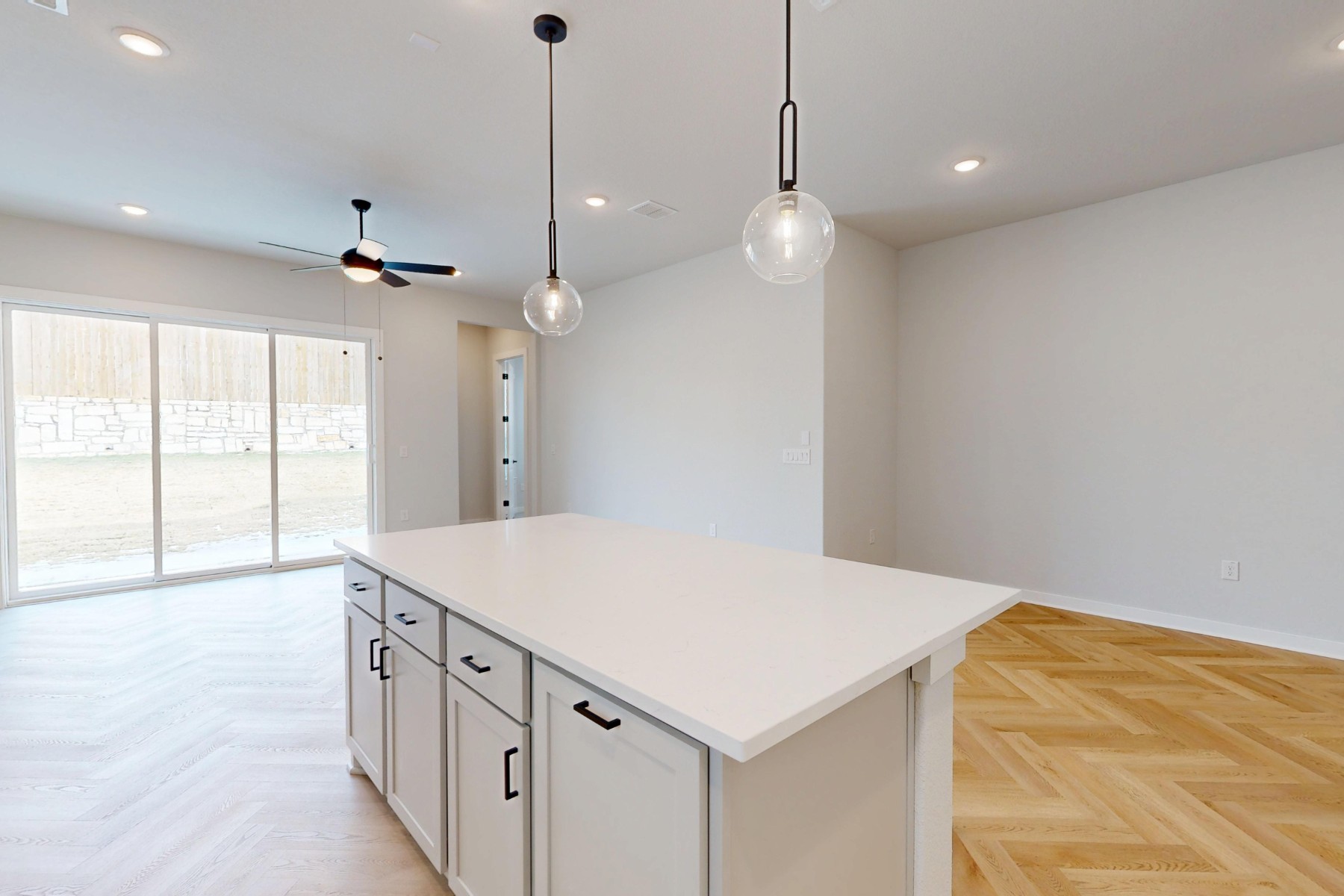 812 Boise Drive Leander, TX 78641 - Photo 7 of 35 a kitchen with a stove a sink a center island and a window