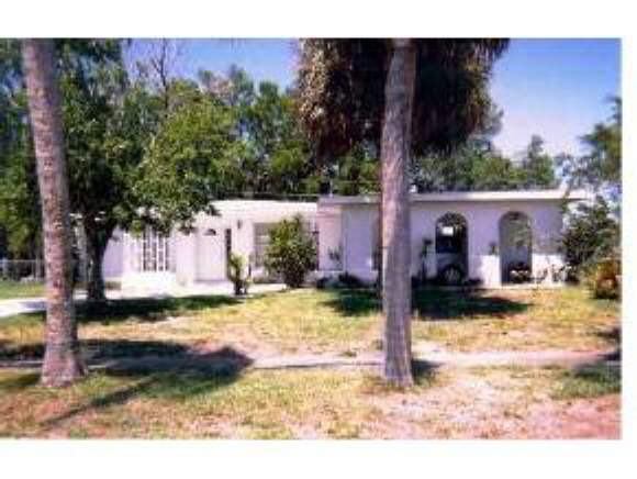 913 Northeast Darwin Palm Bay, FL 32905 - Photo 1 of 3 a view of a house with backyard