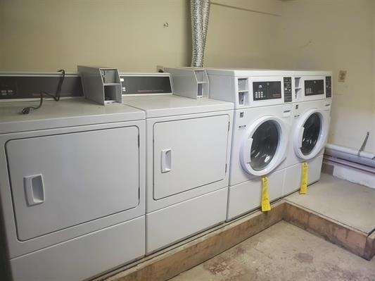 18 Mechanic Street Bayonne, NJ 07002 - Photo 5 of 8 a utility room with dryer and washer