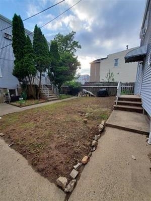 18 Mechanic Street Bayonne, NJ 07002 - Photo 6 of 8 a view of a backyard of the house