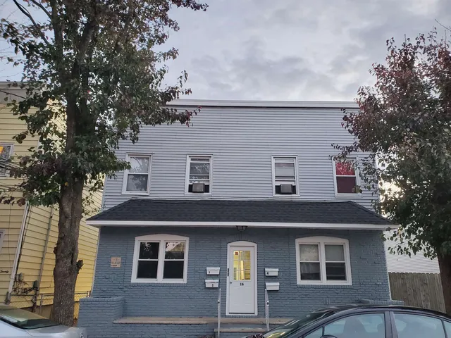 front view of a house with a trees