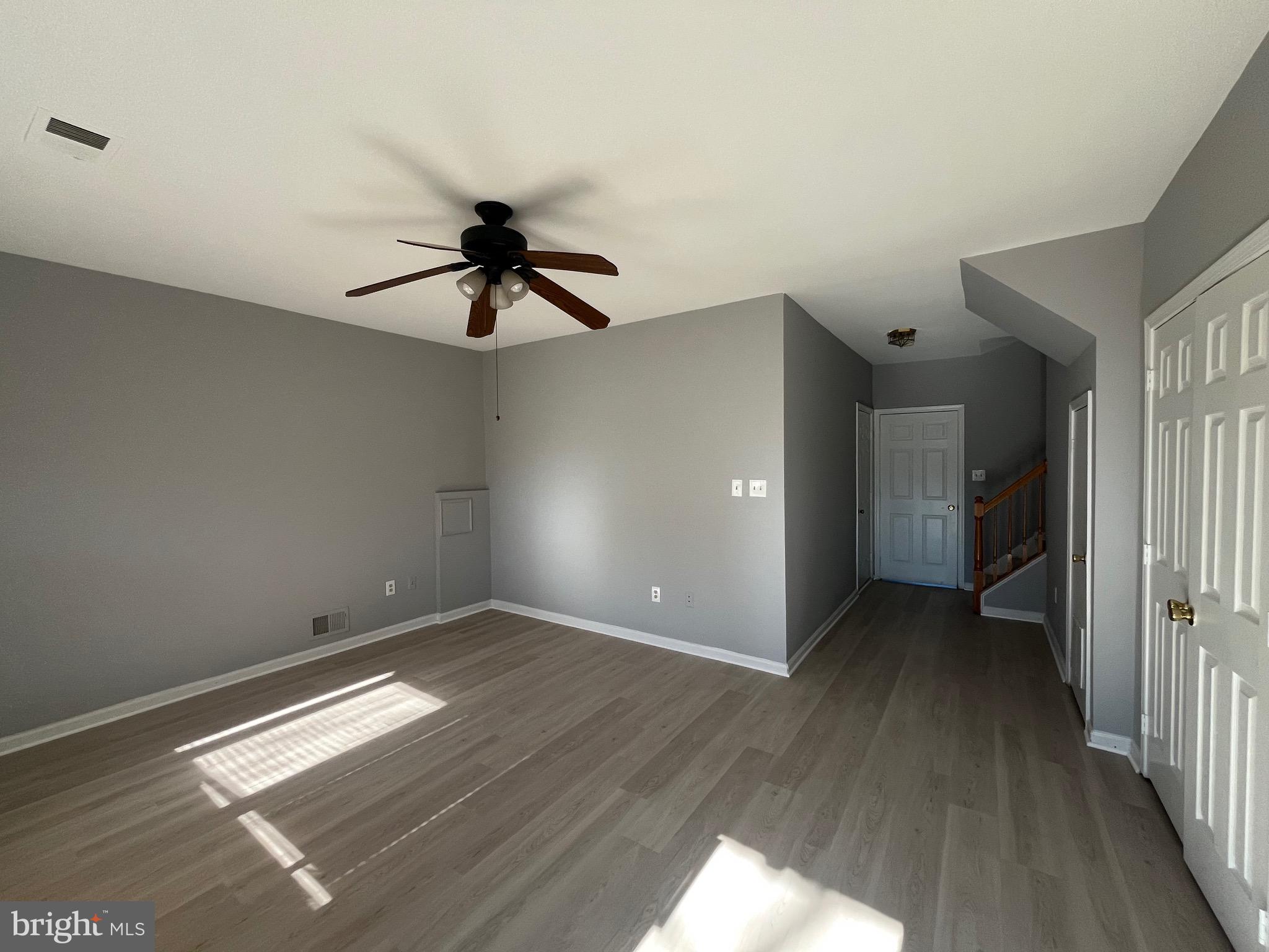 14861 Bolton Road Centreville, VA 20121 - Photo 11 of 17 wooden floor in an empty room with a window