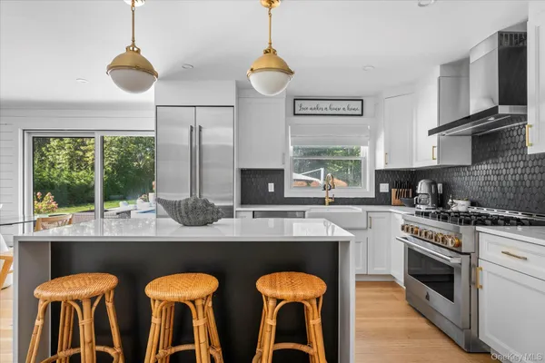 a kitchen with stainless steel appliances granite countertop a stove and a sink