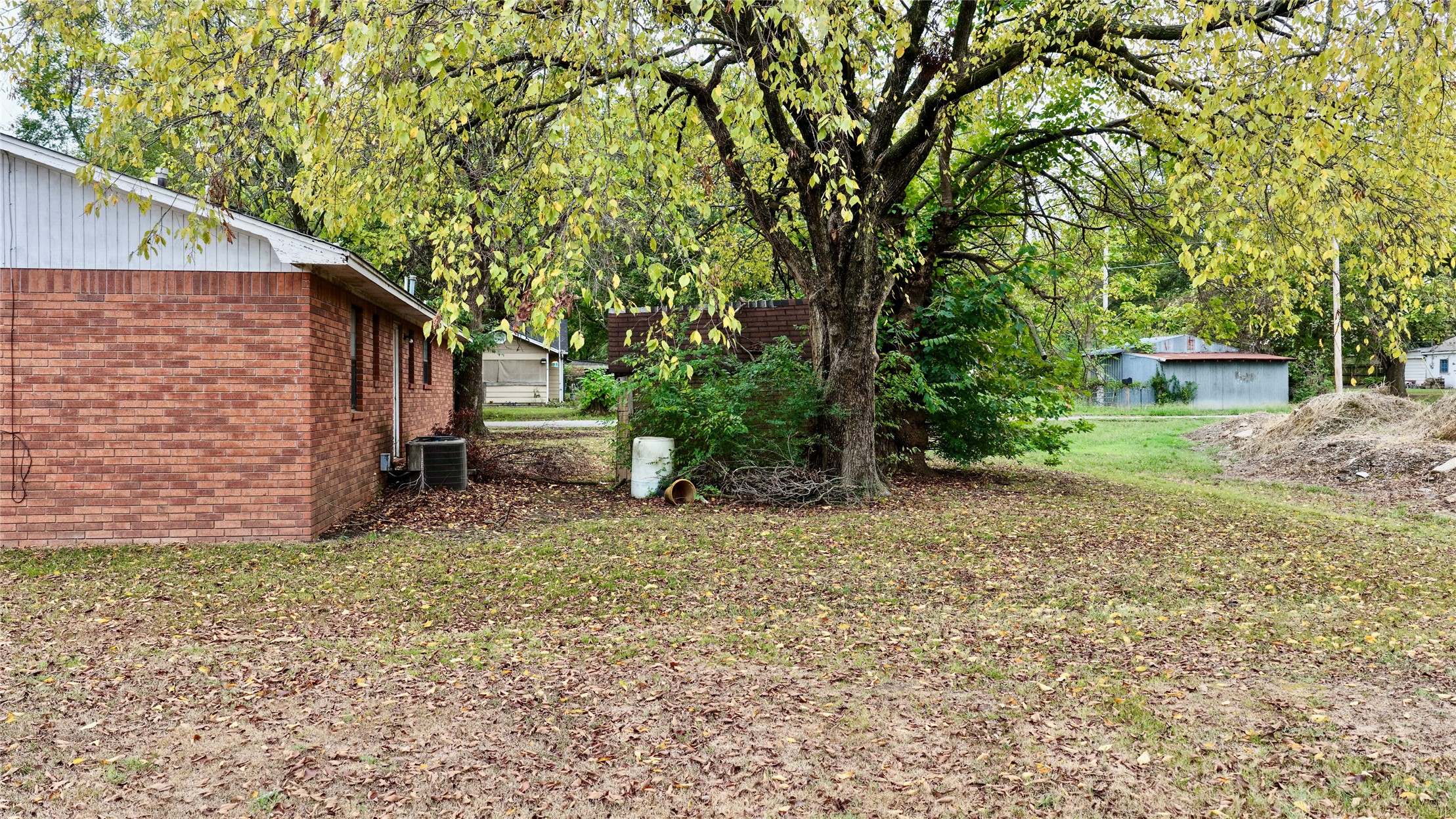 602 Northwest 4th Street Checotah, OK 74426 - Photo 22 of 28 Brick exterior with white siding