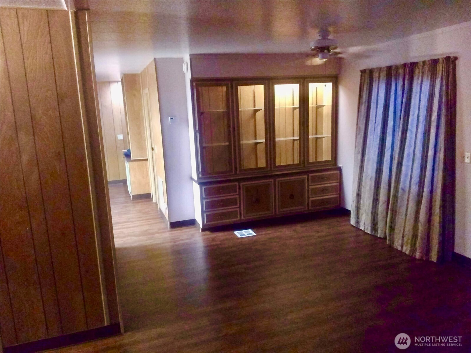 402 West 6th Avenue Ritzville, WA 99169 - Photo 13 of 19 an empty room with wooden floor and windows