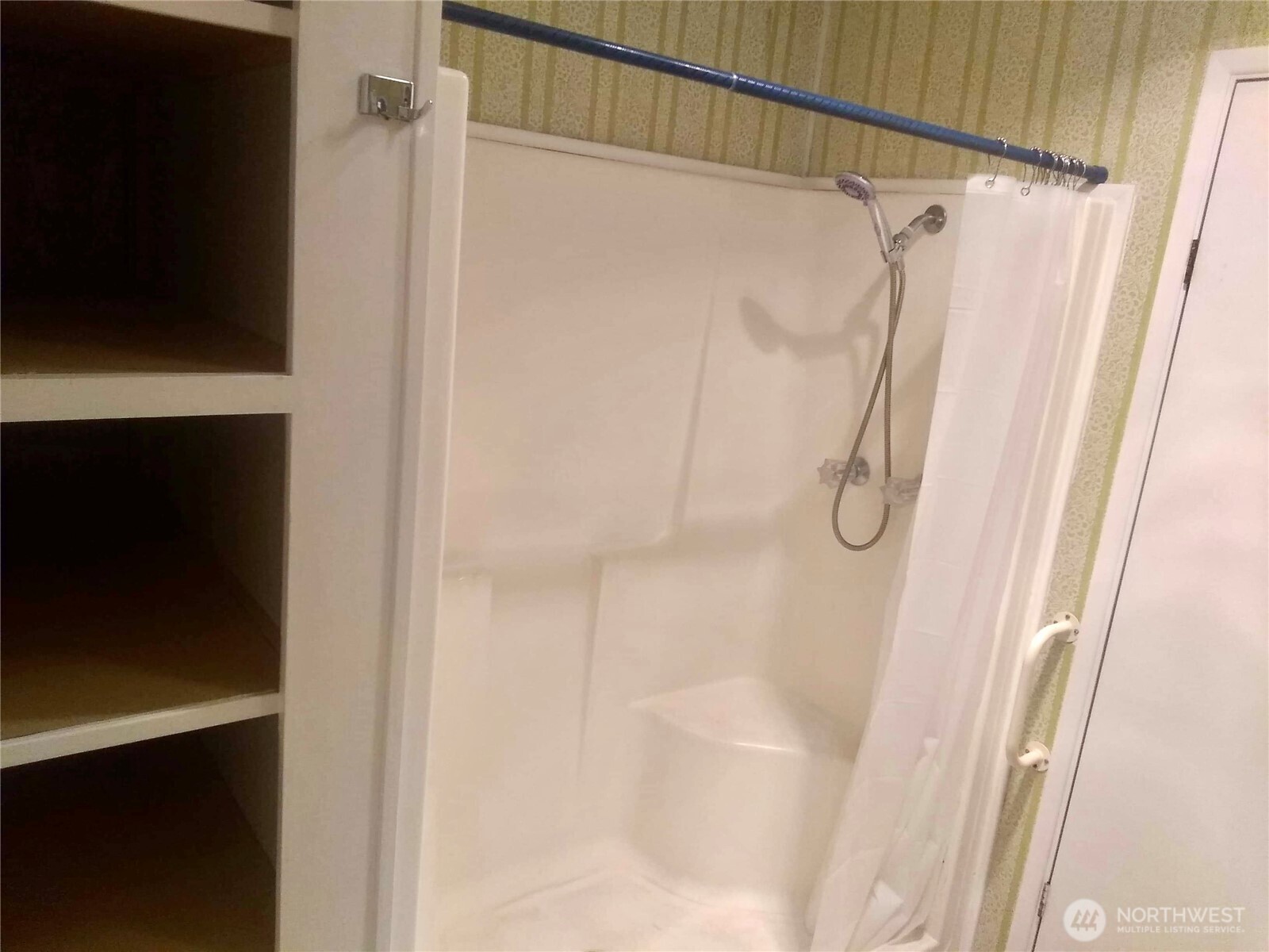 402 West 6th Avenue Ritzville, WA 99169 - Photo 7 of 19 a bathroom with a shower and a glass door