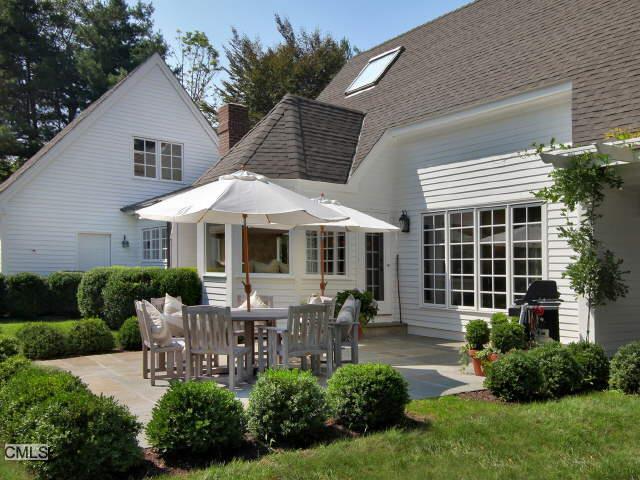 370 Mine Hill Road Fairfield, CT 06824 - Photo 1 of 1 a patio with sofas fire pit and garden
