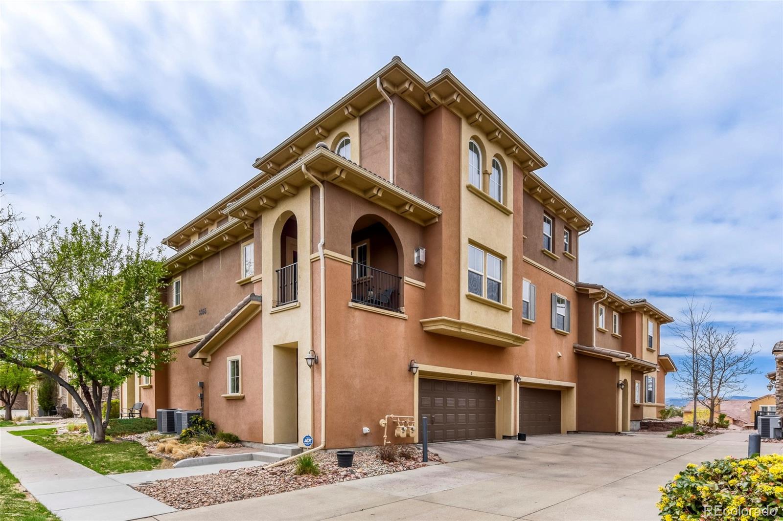 3355 Cascina Circle, Unit B Highlands Ranch, CO 80126 - Photo 1 of 28 a front view of a large building
