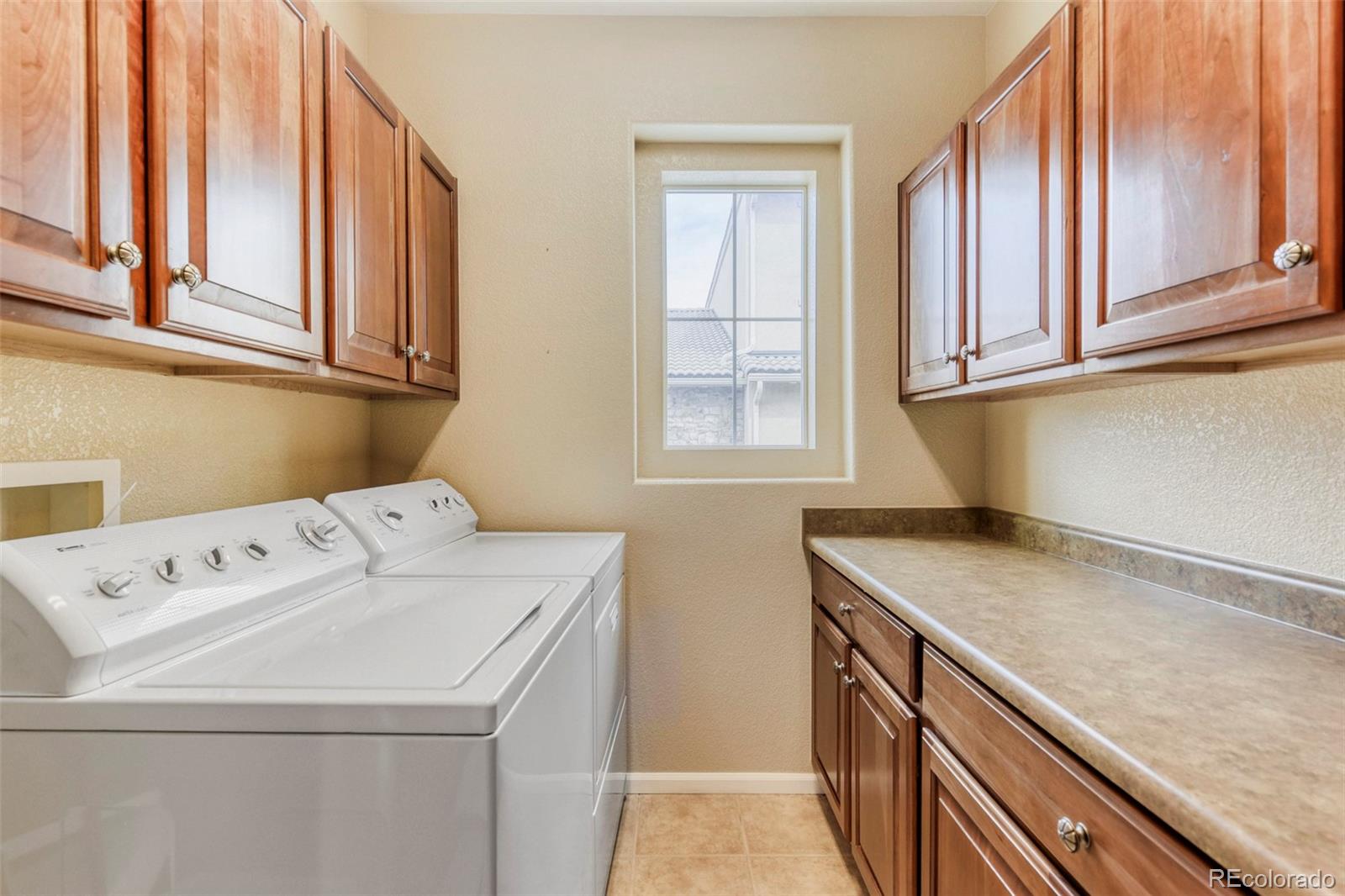 3355 Cascina Circle, Unit B Highlands Ranch, CO 80126 - Photo 23 of 28 a utility room with dryer and washer