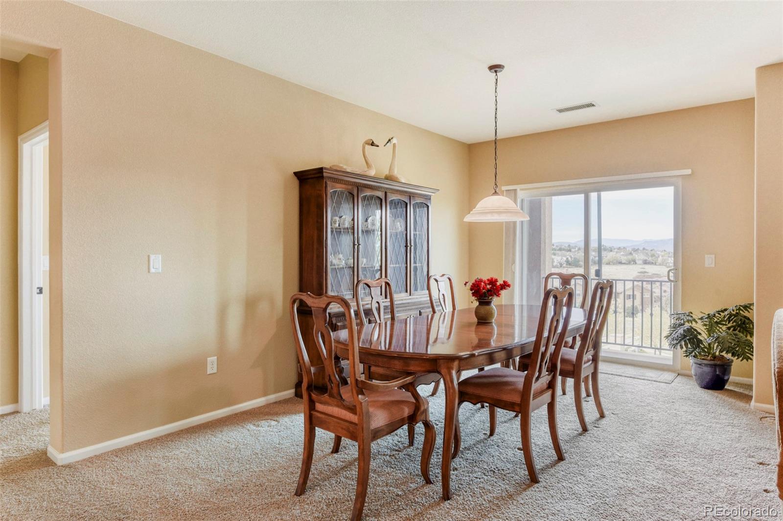 3355 Cascina Circle, Unit B Highlands Ranch, CO 80126 - Photo 9 of 28 a view of a dining room with furniture window and outside view