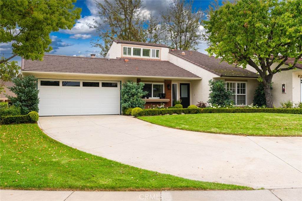 Extended driveway and beautifully landscaped front yard