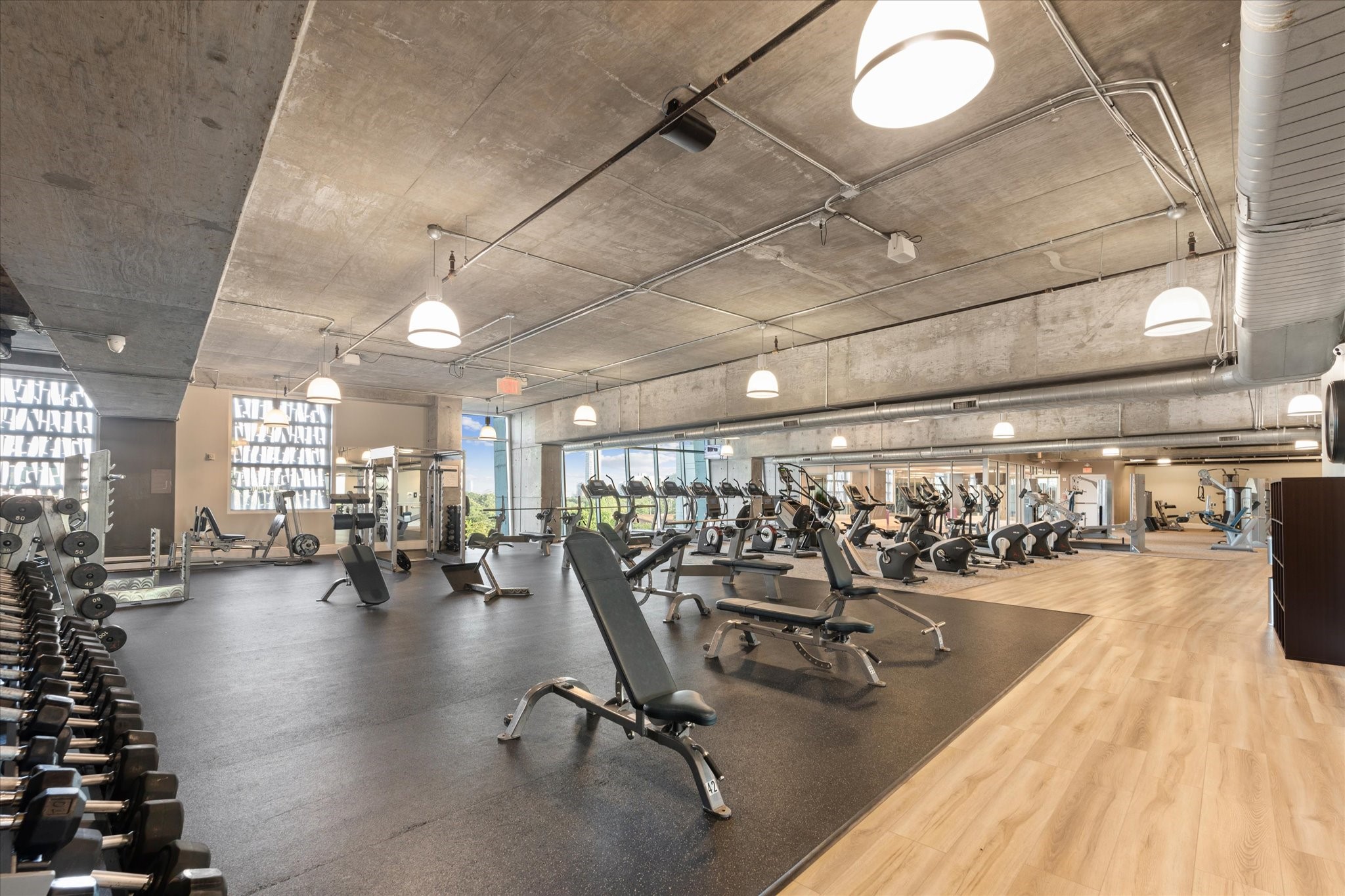 5925 Almeda Road, Unit 10806 Houston, TX 77004 - Photo 9 of 34 Massive gym with free weights and machines overlooking Herman Park. Many residents cancel their outside memberships once moving in at the Mosaic.