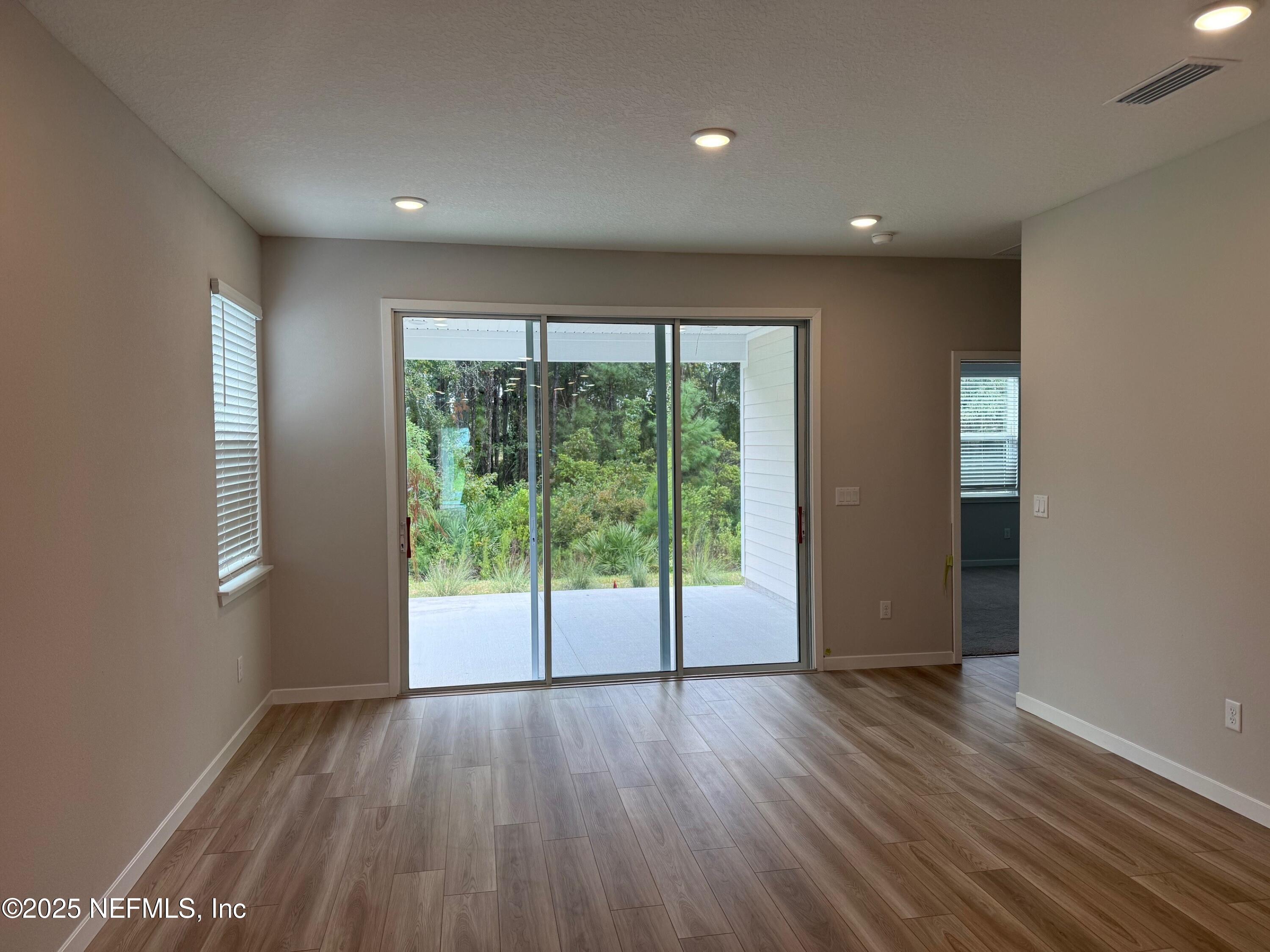 96501 Stillpoint Way Fernandina Beach, FL 32034 - Photo 6 of 14 Captiva 44 great room with slider out to
