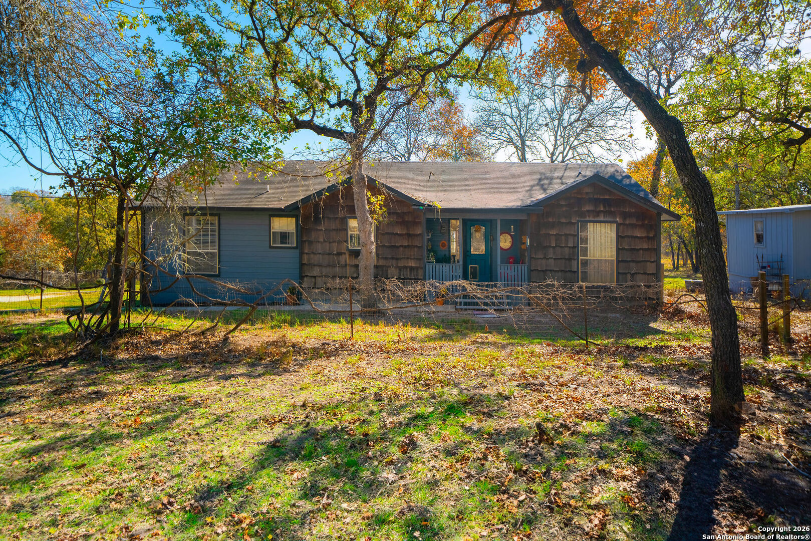 119 Post Oak Road La Vernia, TX 78121 - Photo 1 of 38 a front view of house with yard
