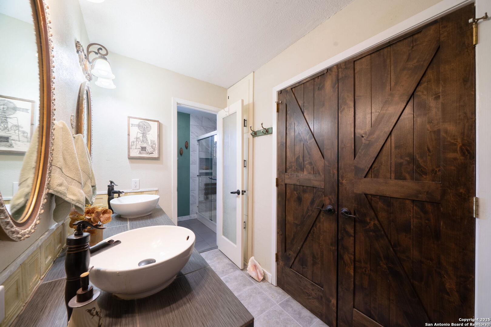 119 Post Oak Road La Vernia, TX 78121 - Photo 16 of 38 a bathroom with a toilet sink and shower curtain