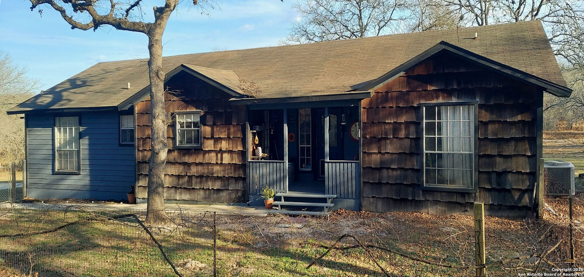 119 Post Oak Road La Vernia, TX 78121 - Photo 2 of 38 a front view of a house with a garage