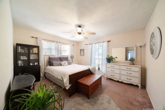 a room with a bed window and couch