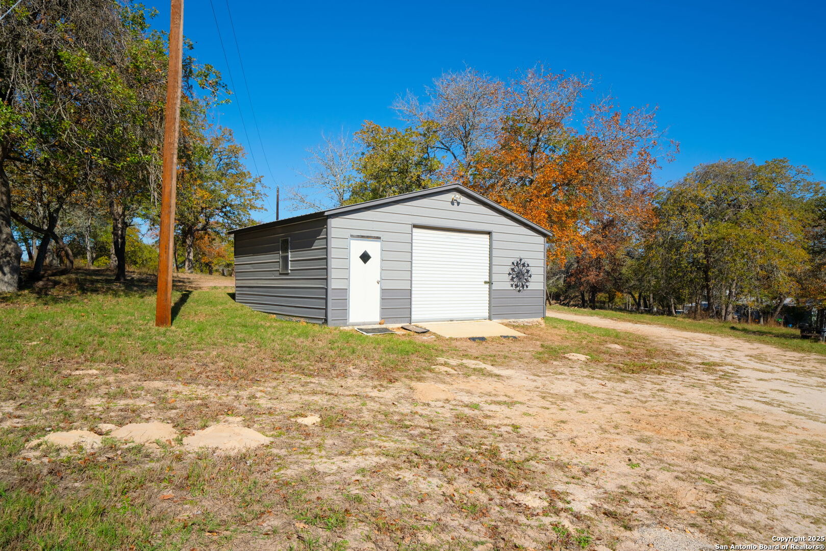 119 Post Oak Road La Vernia, TX 78121 - Photo 26 of 38 a view of a house with a yard