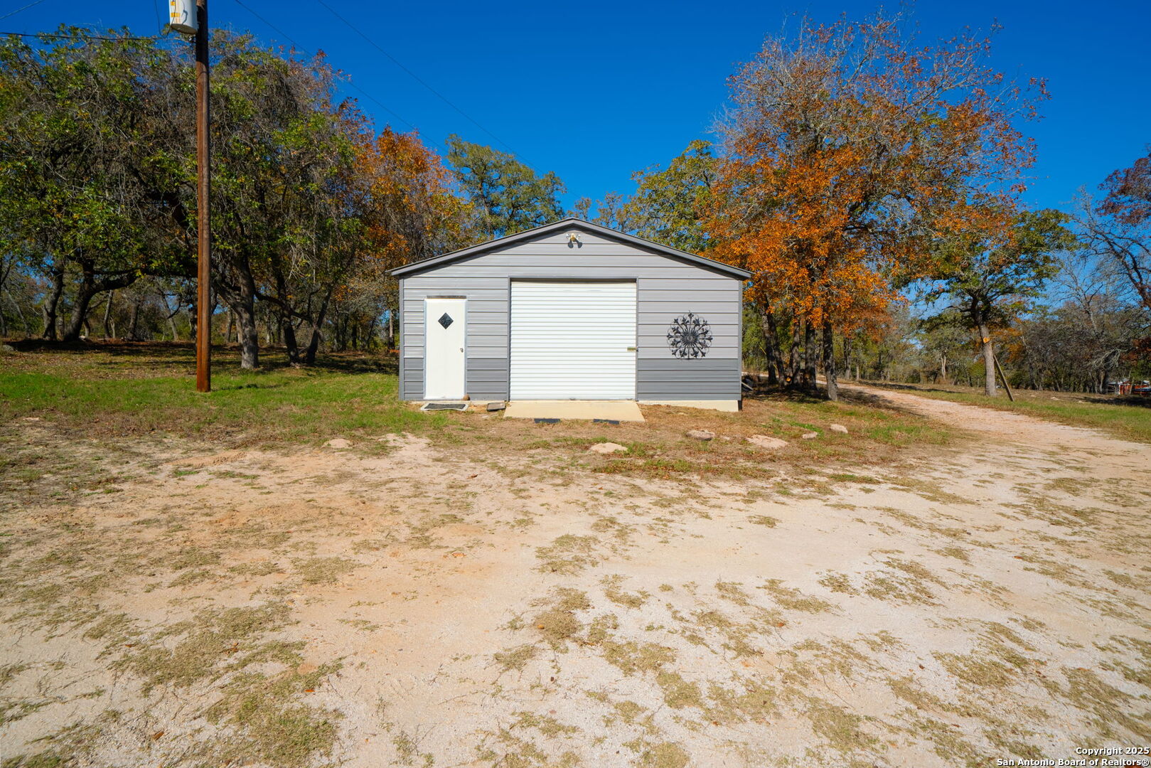 119 Post Oak Road La Vernia, TX 78121 - Photo 27 of 38 a view of a house with a yard